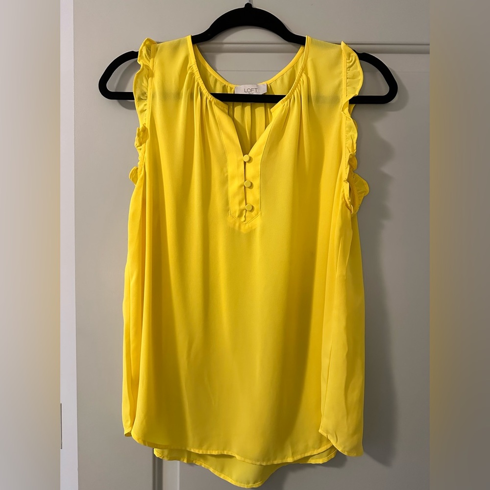 Yellow sleeveless blouse